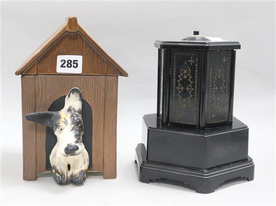 A bakelite musical cigarette dispenser and a similar Crown Derby pottery kennel, 21cm.